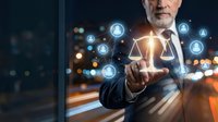 Mature businessman holding glowing justice scales with network connections representing legal technology and digital law services at night.