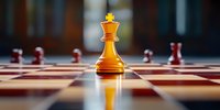 Golden queen chess piece standing on wooden chessboard with red pieces in background, dramatic lighting creates reflection and depth for business strategy concept.