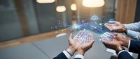 Business professionals holding digital network connections with glowing data visualization and technology interface in modern office environment.