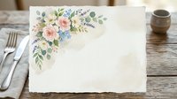 Blank floral stationery with watercolor roses and greenery in corner, styled on wooden table with cutlery for wedding invitations and event planning.
