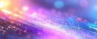 Vibrant glitter background with pink and blue bokeh lights creating magical sparkle effect on reflective surface, abstract festive macro photography.