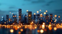 Modern cityscape with glowing bokeh lights in foreground creating magical urban atmosphere at dusk, skyscrapers silhouettes against blue twilight sky.