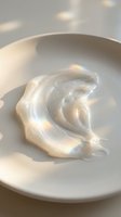 Creamy whipped topping swirl in white ceramic bowl with soft natural lighting, suitable for food styling, culinary content, dessert recipes, and bakery marketing materials.