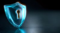 Glowing blue shield with keyhole symbol on dark background represents cybersecurity, data protection and digital privacy concepts for business technology.
