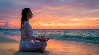 Young Asian woman practicing meditation yoga on tropical beach during golden sunset with peaceful ocean waves and colorful sky for wellness and mindfulness.