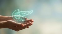 Holographic pancreas organ floating above cupped hands representing medical technology, healthcare innovation and digestive system anatomy visualization.