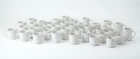 Large collection of white ceramic coffee mugs arranged in rows on clean white background for commercial kitchen and restaurant supply concepts.
