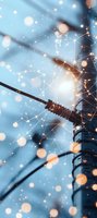 Network connection with glowing constellation pattern overlay against blue sky background, electric power line and pole with magical bokeh light effects.