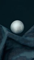 Glowing white sphere floating above flowing dark blue fabric creating mystical atmospheric scene with dramatic lighting and shadows.