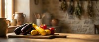 Fresh colorful vegetables on wooden cutting board in rustic kitchen with warm sunlight streaming through window creating cozy cooking atmosphere.