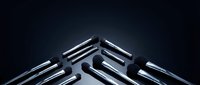Professional makeup brushes with silver metallic handles arranged in a V-shape on dark background, luxury beauty tools collection for cosmetic use.