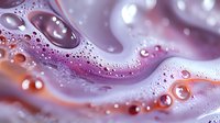Mesmerizing macro photography of water drops and bubbles in pink and purple tones creating abstract fluid art pattern with soft bokeh light effects.