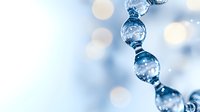 Elegant crystal glass beads in soft blue tones with bokeh light effects creating dreamy atmosphere. Decorative elements catch and reflect light in magical way.
