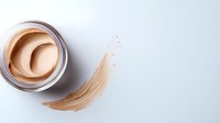 Cosmetic foundation cream jar with smooth beige makeup smear on white background for beauty skincare and cosmetics advertising campaigns.
