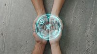 Hands of diverse individuals holding glowing digital sphere with holographic data visualization, representing teamwork, technology innovation, and global connectivity for business solutions.