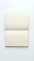 Open blank notebook with cream pages on white background for writing notes and creative projects.