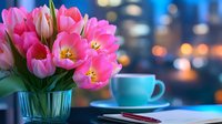 Pink tulips in glass vase with coffee cup on table against blurred city lights background. Spring flowers arrangement for home decor and lifestyle concepts.