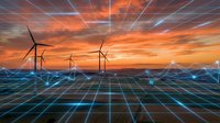 Wind turbines generating renewable energy against dramatic sunset sky with digital grid overlay representing sustainable technology and smart power distribution network.