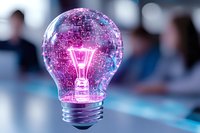 Glowing light bulb with pink neon filament inside glass sphere against blurred background, creative innovation concept for business and technology solutions.