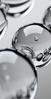 Abstract macro photography of water drops and bubbles creating metallic silver reflections and curved surfaces against light background, suitable for modern design projects.