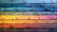 Colorful wooden planks background with natural knots and grain texture in rainbow gradient from blue through yellow to pink, rustic horizontal boards pattern.