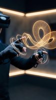 Businessman hands creating glowing digital wireframe spiral with futuristic holographic technology in modern office environment for innovation concepts.