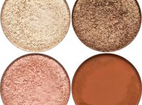 Eyeshadow palette swatches displaying four warm-toned shades ranging from champagne glitter to bronze, rose gold, and terracotta matte finishes for makeup application and cosmetic product promotion.