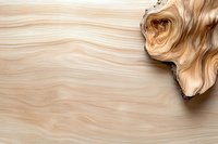 Natural wood grain texture with curved organic shapes and swirling patterns in light beige tones, featuring unique burl detail in corner for luxury furniture design.