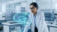 Female scientist of South Asian descent wearing lab coat and glasses examining glowing digital brain hologram in modern laboratory setting for research and technology concepts.