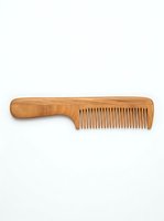 Wooden hair comb with handle isolated on white background, ready for grooming product design, haircare packaging, and salon beauty applications.