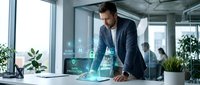 Young male professional of mixed ethnicity wearing dark business suit working with holographic digital interface display at modern office desk with plants and windows.