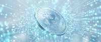 Silver cryptocurrency coin with circuit board patterns and glowing light rays on a blue digital background, symbolizing blockchain technology.