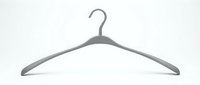 Gray plastic clothes hanger isolated on white background, minimalist wardrobe organizer for clothing storage and retail display.