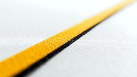 Diagonal yellow and black line pattern on white textured surface creates dynamic perspective and minimalist composition for modern design backgrounds.