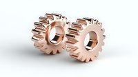 Rose gold metallic gears with straight teeth isolated on white background, mechanical engineering component for industrial machinery and power transmission.