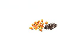 Candy corn and bat decoration isolated on white background, ready for Halloween design projects, greeting cards, and seasonal marketing materials.