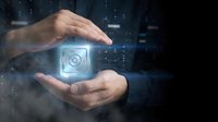Hands protecting glowing digital safe icon with security lock symbol, representing data protection, cybersecurity, and secure cloud storage solutions for business.
