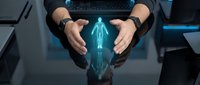 Businessman hands protecting glowing blue holographic human figure above digital tablet in modern office environment for healthcare technology concepts.