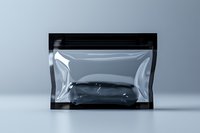 Clear plastic zip lock bag with black trim on gray background, empty transparent pouch showing reflective surface and resealable closure for packaging design.