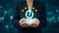 Professional businesswoman in dark suit holding glowing customer satisfaction symbol with five golden stars representing quality service and positive feedback.