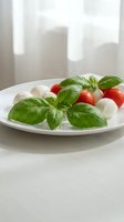 Fresh caprese salad with mozzarella cheese, cherry tomatoes and basil leaves on white plate. Healthy Mediterranean appetizer for restaurant menu design.