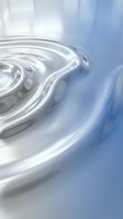 Clear water ripples creating concentric circles on calm surface with soft blue reflections and gentle wave motion for wellness and tranquility concepts.