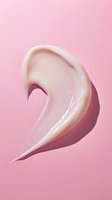 Creamy white cosmetic texture swirl on pink background, showing smooth glossy moisturizer or skincare product sample with elegant curved shape and soft shadow.