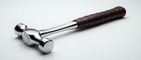 Polished chrome ball-peen hammer with leather-wrapped handle on white background, isolated tool for construction, repair, and metalworking projects.
