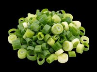 Freshly chopped green onions pile isolated on transparent background, ready for food design, stickers, print on demand, T-shirts, and culinary clipart use.