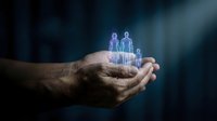 Cupped hands holding glowing holographic family figures representing protection, care and insurance concepts for business presentations.