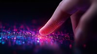 Finger touching digital surface with glowing pink and purple light particles, representing futuristic technology interface and data visualization concept.