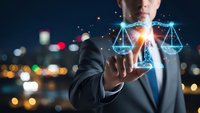 Professional businessman touching digital justice scales hologram with glowing network connections against blurred city lights background at night.