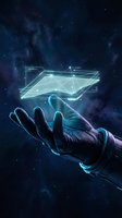 Robotic hand holding glowing holographic tablet with digital interface against starry night sky background for technology concepts.