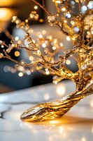Glowing golden branches with sparkling lights and bokeh effect create magical holiday atmosphere on white surface, close-up macro photography.